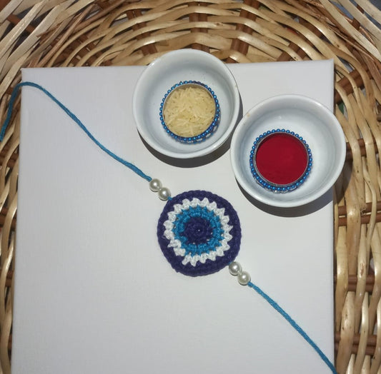 Stunning Blue Evil Eye Crochet Rakhi with White Beads