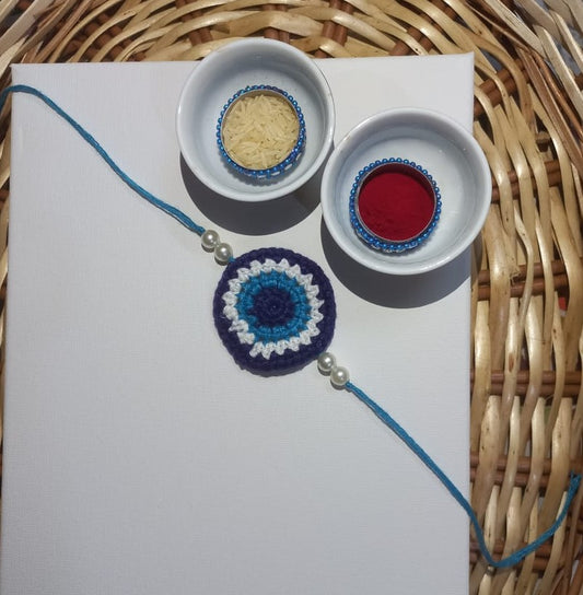 Stunning Blue Evil Eye Crochet Rakhi with White Beads